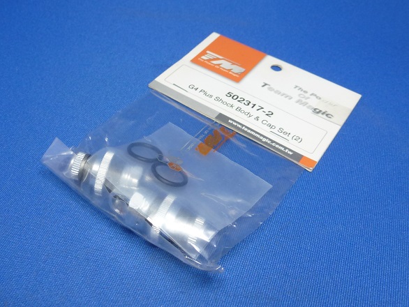 Team Magic 502317-2 - Shock Body & Cap Set, 2pcs (G4+)