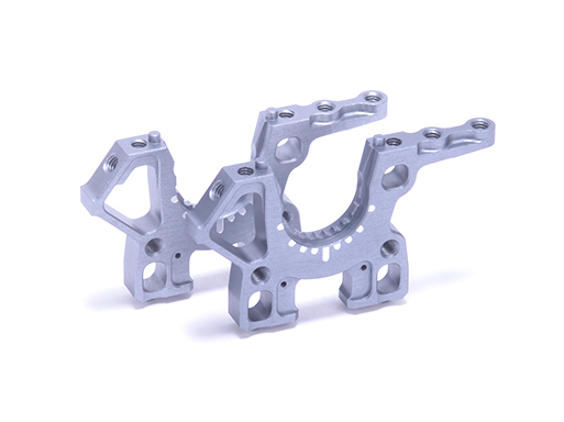 Schumacher U9469 -  Front Alloy Trans Housing High, Kit (Mi10)